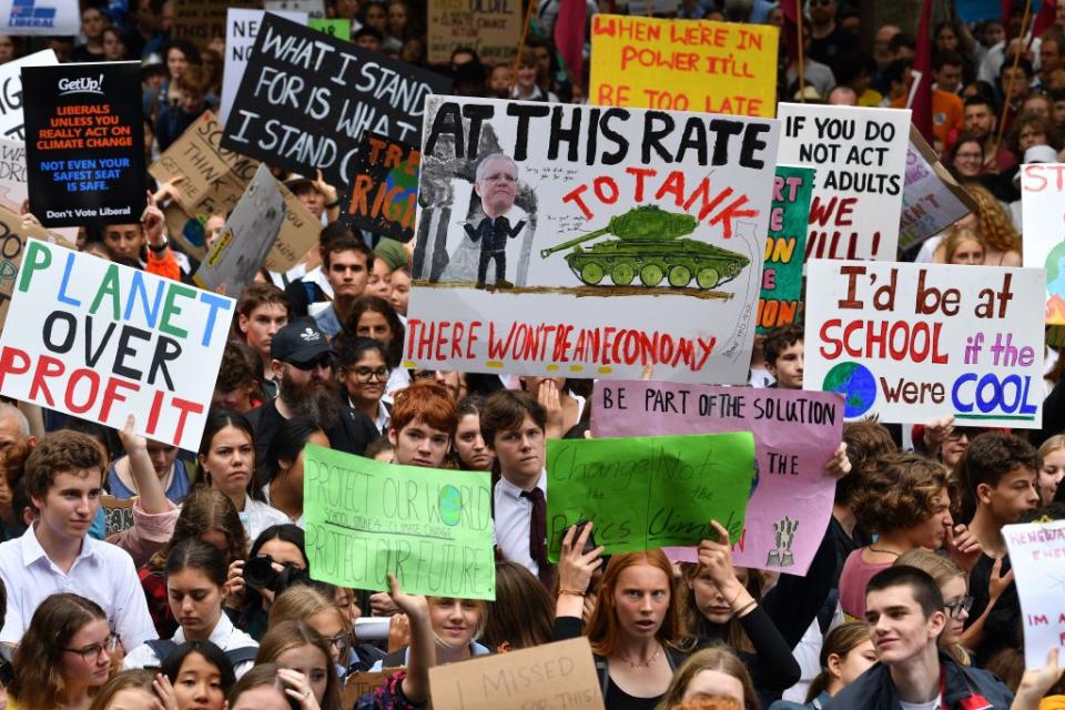 School children shout slogans during a strike and protest by students highlighting inadequate progress to address climate change in Sydney on March 15, 2019. (Photo by SAEED KHAN/AFP/Getty Images)