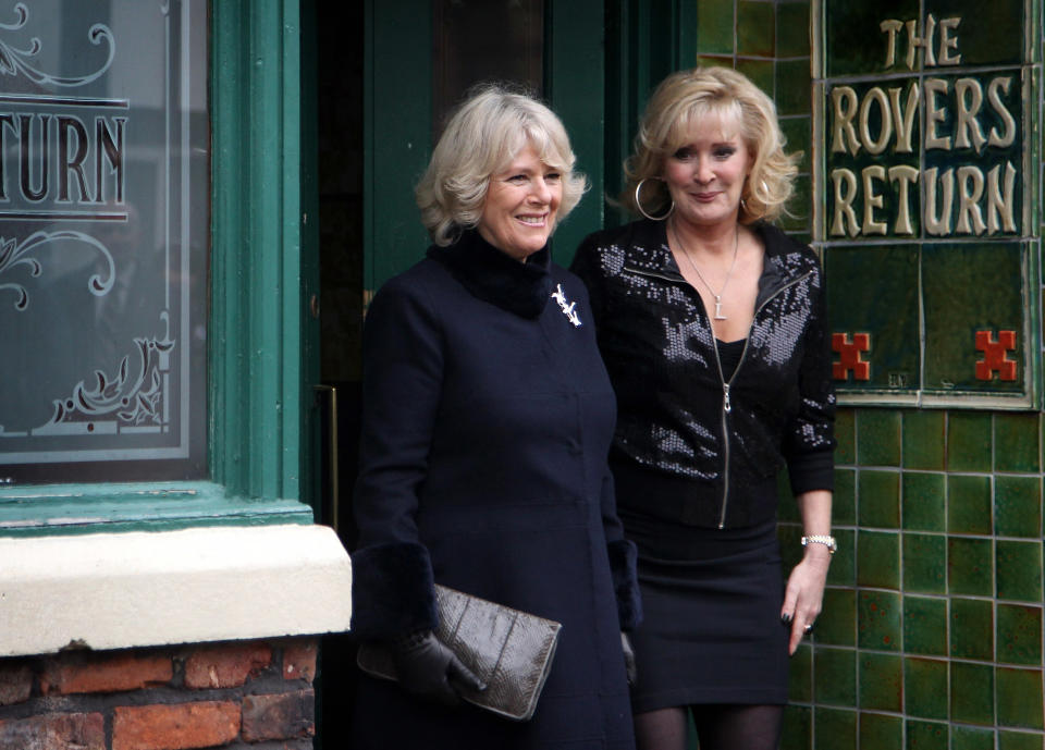 MANCHESTER, ENGLAND - FEBRUARY 04:  Camilla, Duchess of Cornwall laughs as she chats to cast member Beverley Callard outside the Rovers Return during a tour of the Coronation Street set on February 4, 2010 in Manchester, England.  (Photo by Chris Jackson/Getty Images)