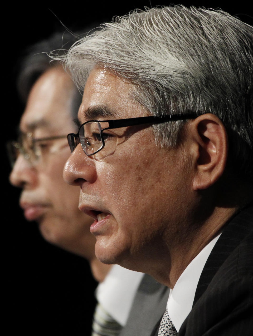 Sony Corp. Chief Financial Officer Masaru Kato, right, speaks during a press conference at the Sony headquarters in Tokyo Tuesday, April 10, 2012. Sony more than doubled Tuesday its projected annual loss to 520 billion yen ($6.4 billion), its worst red ink ever, due to a massive tax charge. Sony executive Takemi Nagasaka is seen at left. (AP Photo/Koji Sasahara)