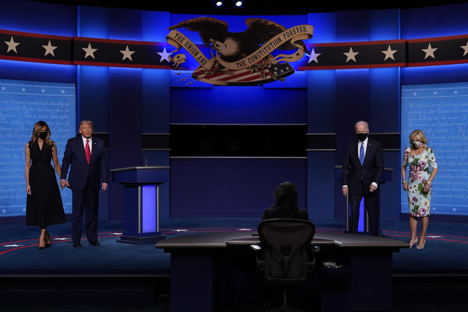 From l-r., first lady Melania Trump, President Donald Trump, moderator Kristen Welker of NBC News, Democratic presidential candidate former Vice President Joe Biden and his wife Jill Biden on stage at the conclusion of the second and final presidential debate Thursday, Oct. 22, 2020, at Belmont University in Nashville, Tenn. (AP Photo/Patrick Semansky)