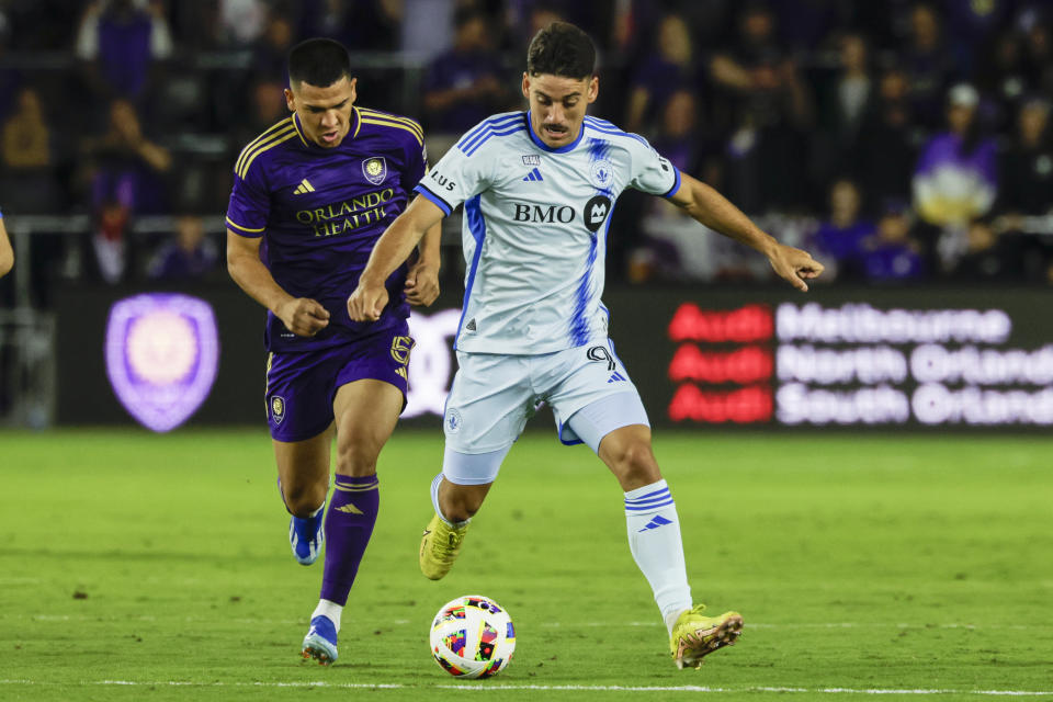 CF Montréal forward Chinonso Offor, right, is defended by Orlando City midfielder César Araújo during the first half of an MLS soccer match Saturday, Feb. 24, 2024, in Orlando, Fla. (AP Photo/Kevin Kolczynski)