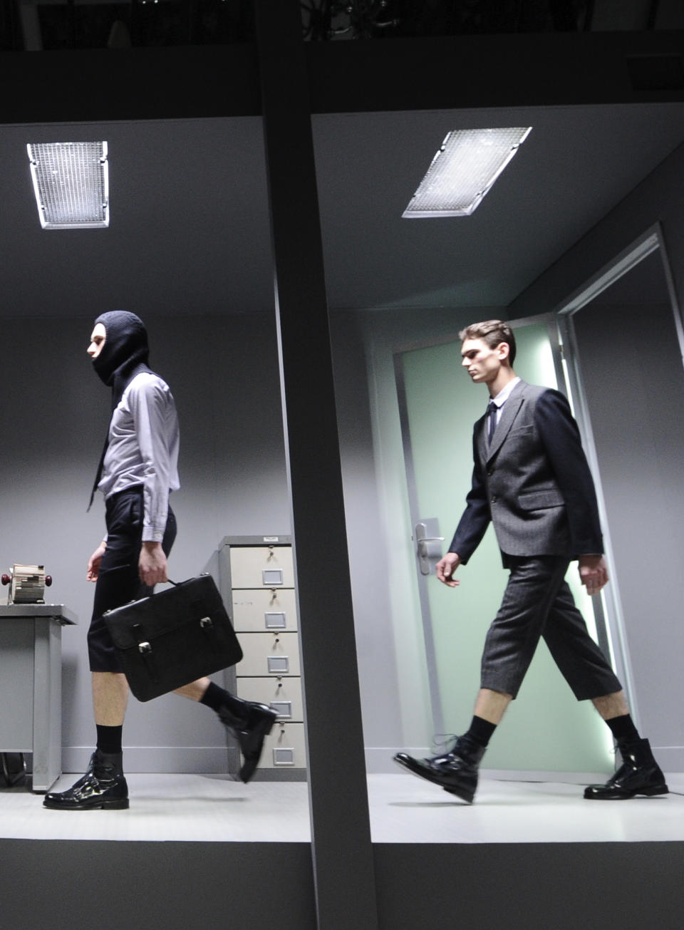 Models wear creations by French fashion designer Guillaume Henry for Carven's fall-winter 2013/2014 men's fashion collection, presented in Paris, Wednesday, Jan.16, 2013. (AP Photo/Zacharie Scheurer)