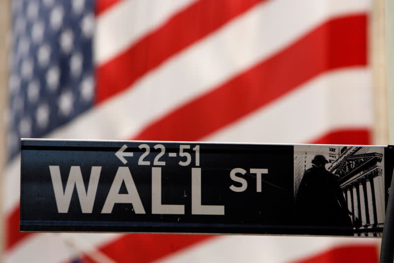 FILE PHOTO: A Wall Street sign is seen outside of the New York Stock Exchange