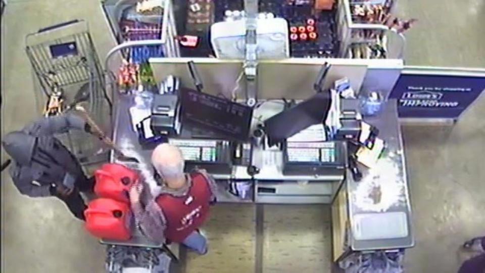 Andre McDonald is seen at the checkout of a Lowes store. Two red gas cans can be seen on the counter. / Credit: Bexar County District Courts