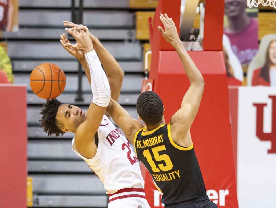 Indiana forward Trayce Jackson-Davis (23) and Iowa forward Keegan Murray (15) battle for a rebound during the second half of an NCAA college basketball game, Sunday, Feb. 7, 2021, in Bloomington, Ind. (AP Photo/Doug McSchooler)