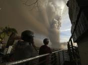 People watch plumes of smoke and ash rise from as Taal Volcano erupts Sunday Jan. 12, 2020, in Tagaytay, Cavite province, outside Manila, Philippines (AP Photo/Aaron Favila)