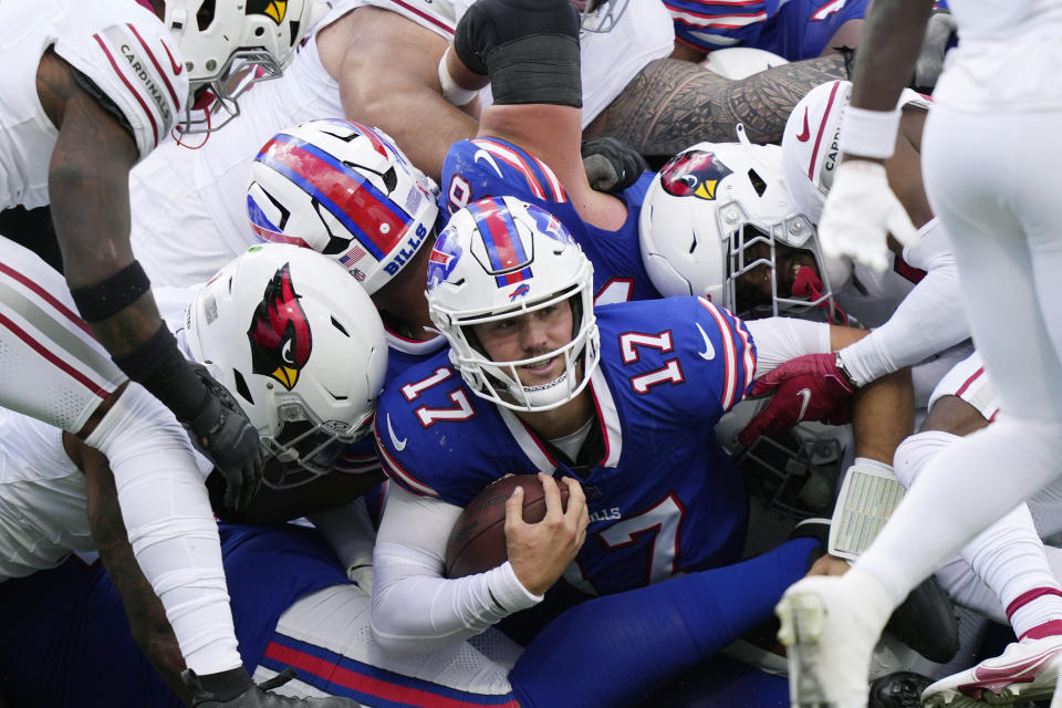 Buffalo Bills quarterback Josh Allen (17) runs for a first down against the Arizona Cardinals during the second half of an NFL football game Sunday, Sept. 8, 2024, in Orchard Park, N.Y. (AP Photo/Matt Slocum)