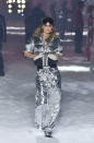 <p>Model wears a silver foil metallic puffer jacket and pants at the Philipp Plein FW18 show. (Photo: Getty) </p>