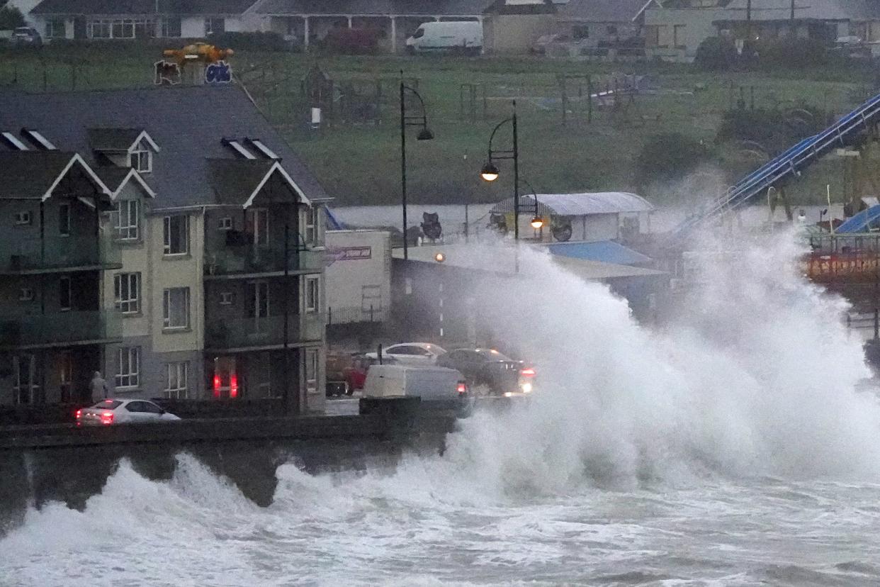 Waves crash against the sea wall in Tramore, County Waterford (Niall Carson/PA) (PA Wire)