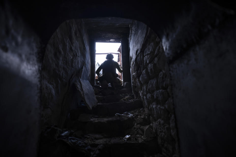 A Ukrainian serviceman from the 3rd Assault Brigade takes cover in a bunker at the frontline in Andriivka, Donetsk region, Ukraine, Saturday, Sept. 16, 2023. Ukrainian brigade's two-month battle to fight its way through a charred forest shows the challenges of the country's counteroffensive in the east and south. (AP Photo/Mstyslav Chernov)