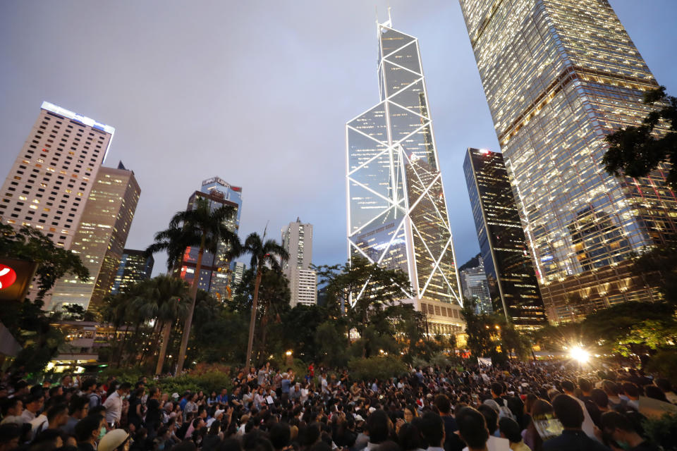 Protesters gather at a demonstration by civil servants in Hong Kong Friday, Aug. 2, 2019. Protesters plan to return to the streets again this weekend, angered by the government's refusal to answer their demands, violent tactics used by police — possibly in coordination with organized crime figures. (AP Photo/Vincent Thian)