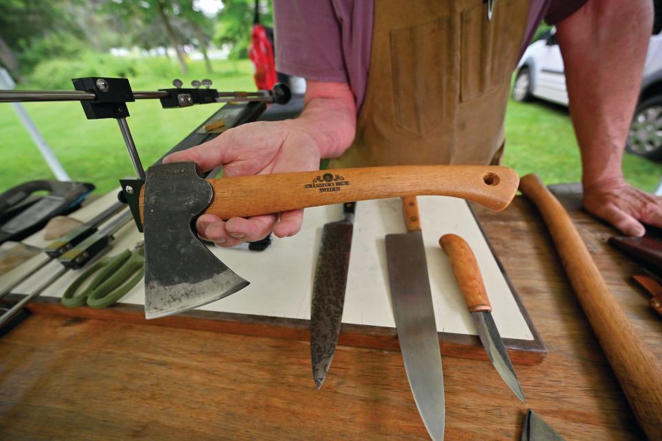 A Garnsfors Bruk axe from Sweden is amongst the selection of blades for sale by knife sharpener David Morrison at the Holden Farmers Market.