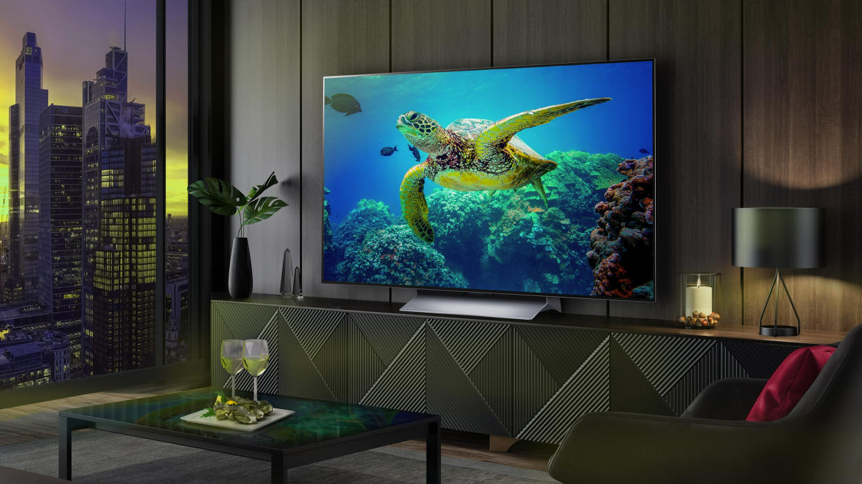  LG C3 OLED TV in a modern apartment living room with a turtle on screen . 