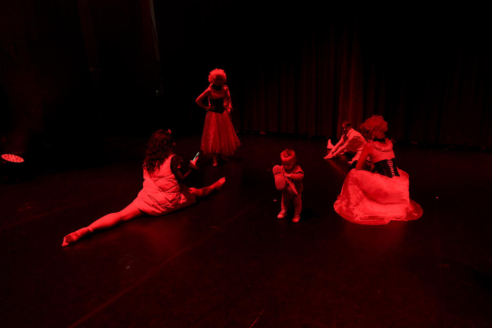 One year old Milana walks on the stage few moments before the start of the show "Alice in Wonderland" in Pistoia, Italy, Friday, May 6, 2022. A Ukrainian circus troupe is performing a never-ending “Alice in Wonderland” tour of Italy. They are caught in the real-world rabbit hole of having to create joyful performances on stage while their families at home are living through war. The tour of the Theatre Circus Elysium of Kyiv was originally scheduled to end in mid-March. (AP Photo/Alessandra Tarantino)