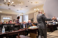 Defense attorney Dick Harpootlian carries off a large photograph to be seen by the jury in the double murder trial of Alex Murdaugh at the Colleton County Courthouse in Walterboro, S.C., Monday, Jan. 30, 2023. (Andrew J. Whitaker/The Post And Courier via AP, Pool)