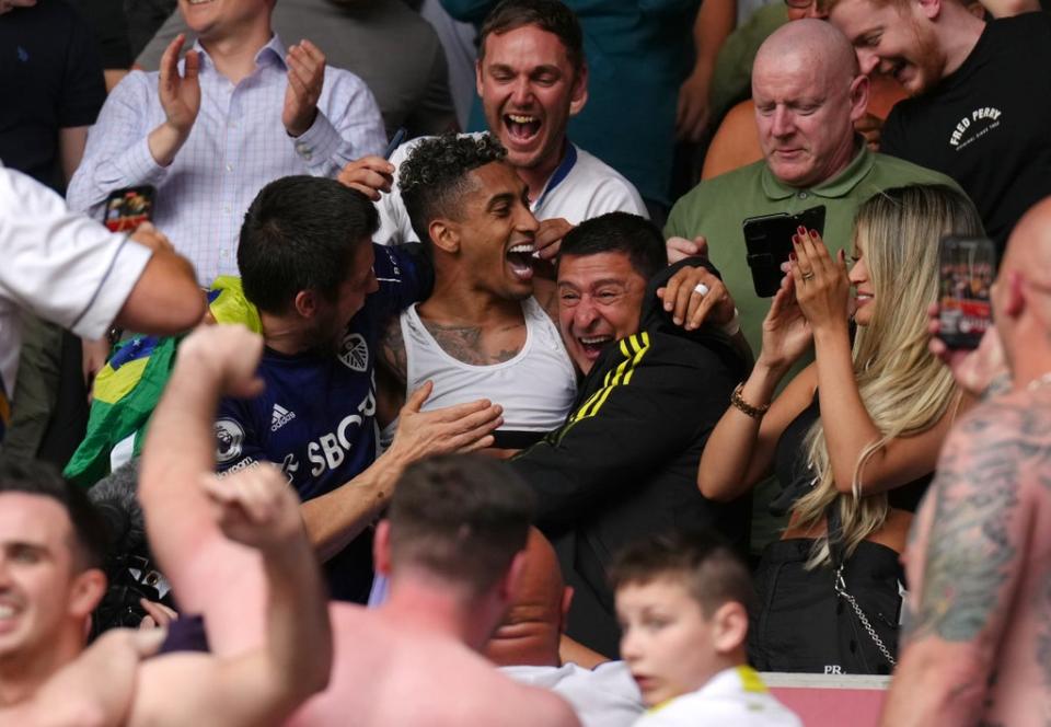 Raphinha celebrates Leeds’ survival in the stands with the fans (John Walton/PA) (PA Wire)