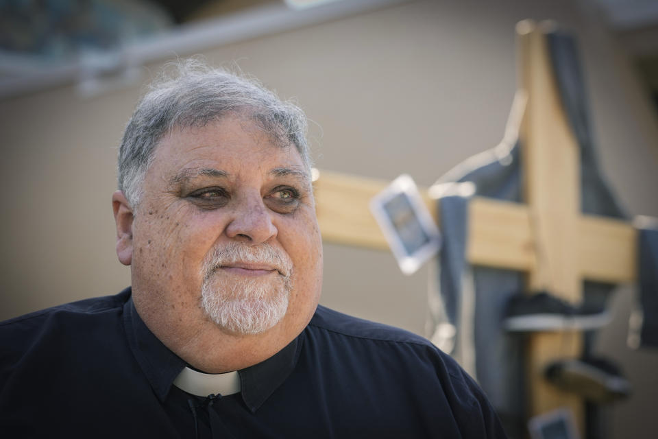 Rev. José Espino, rector of Our Lady of Charity shrine, known as La Ermita, stands in front of the church before leading an Ash Wednesday Mass in Miami, Florida, Wednesday, Feb. 14, 2024. “This is always the place of giving thanks to the Virgin for a safe arrival,” Espino said. (AP Photo/Marta Lavandier)