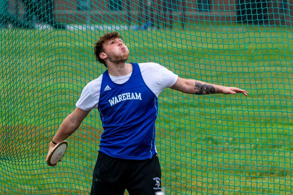 Wareham's Garrett Goodman lets the discus fire and took first in the SCC Championship with a throw of 148.08.