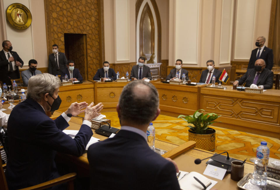 U.S. climate envoy John Kerry, left, chairs his delegations during a meeting with Egyptian Foreign Minister Sameh Shoukry, right, at the foreign ministry headquarters in Cairo, Egypt, Monday, Feb. 21, 2022. (AP Photo/Amr Nabil)