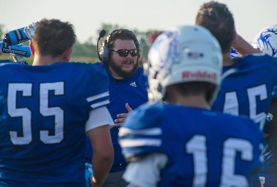 Crestline coach Jonny King talks to his team during a timeout.