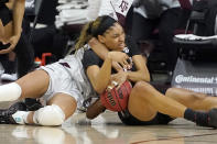 South Carolina forward Victaria Saxton (5) and Texas A&M forward N'dea Jones (31) fight for a loose ball during the first half of an NCAA college basketball game Sunday, Feb. 28, 2021, in College Station, Texas. (AP Photo/Sam Craft)