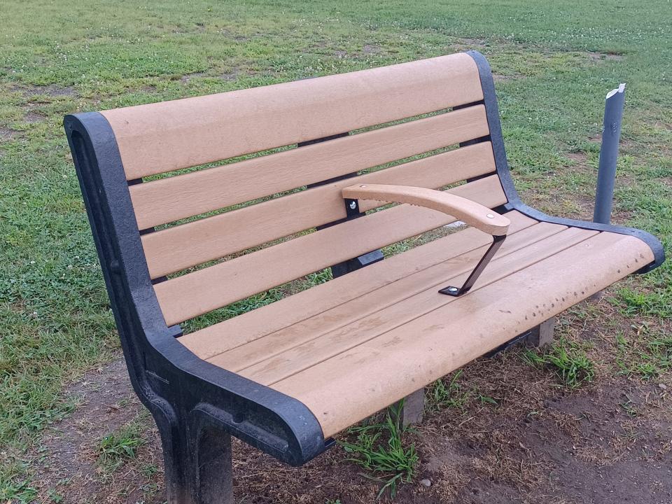 Armrests were recently added to park benches in Woonsocket's Social Park, which is home to a baseball field and bocce courts.