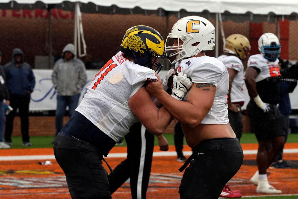 National Team offensive lineman Andrew Stueber of Michigan and offensive lineman Cole Strange of UT-Chattanooga run through drills during practice for the Reese's Senior Bowl Tuesday, Feb. 2, 2022, in Mobile, Ala.