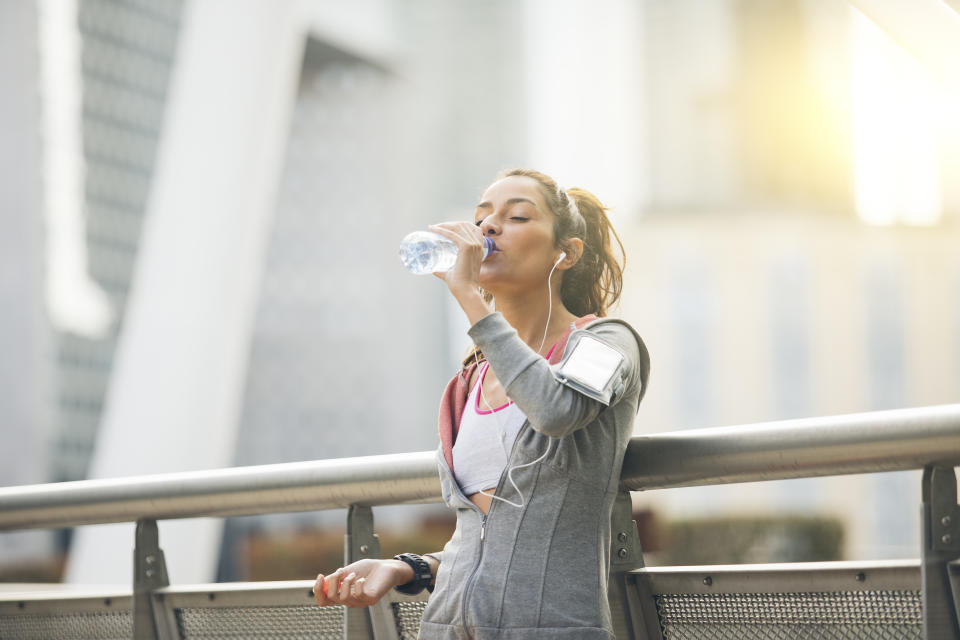 Drinking water and overall weight loss can help with losing fat from the face [Photo: Getty]