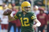 Green Bay Packers' Aaron Rodgers thorws during the first half of an NFL football game against the Washington Football Team Sunday, Oct. 24, 2021, in Green Bay, Wis. (AP Photo/Matt Ludtke)
