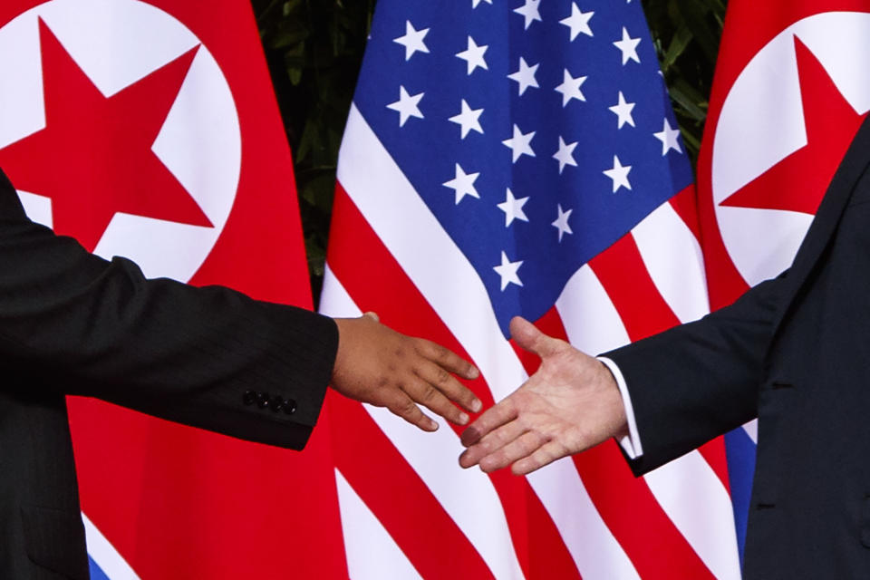 FILE - In this Tuesday, June 12, 2018, file photo, U.S. President Donald Trump, right, reaches to shake hands with North Korea leader Kim Jong Un at the Capella resort on Sentosa Island in Singapore. With the next meeting between the two leaders set for Feb. 27-28 in Vietnam, there’s hope and caution in South Korea on whether the leaders could agree to tangible steps toward reducing the North’s nuclear threat after a year of soaring but fruitless talks. (AP Photo/Evan Vucci, File)