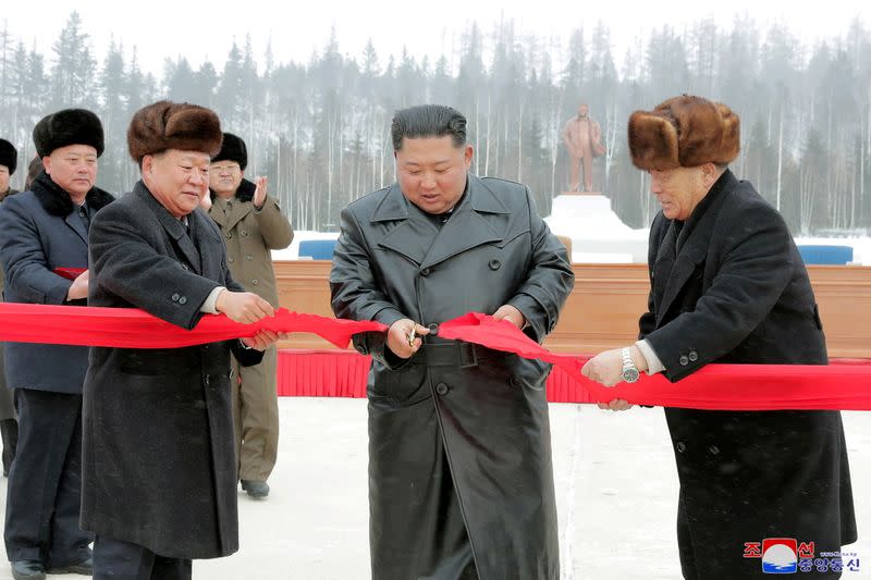 FILE PHOTO: North Korean leader Kim Jong Un cuts the ribbon during a ceremony at the township of Samjiyon County