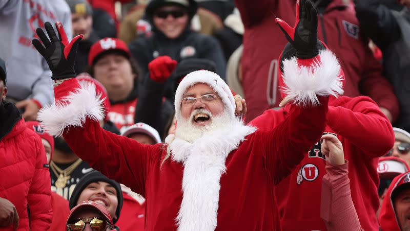 A fan dressed as Santa cheers in Salt Lake City on Saturday, Nov. 25, 2023.