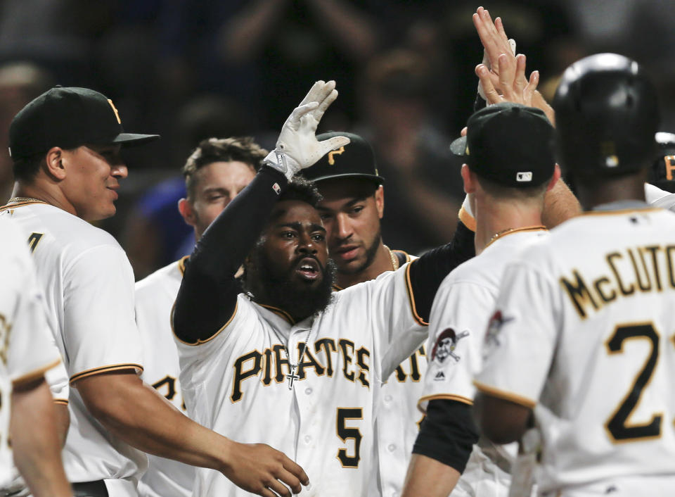 Josh Harrison is congratulated by teammates after hitting a walk-off home run to beat the Los Angeles Dodgers and break up the no-hitter by Dodgers starting pitcher Rich Hill. (AP)