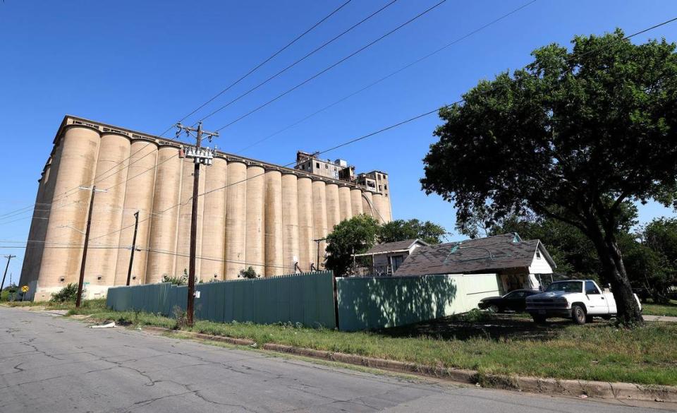 Abandoned silos and grain elevator rise above the Worth Heights neighborhood of Fort Worth.