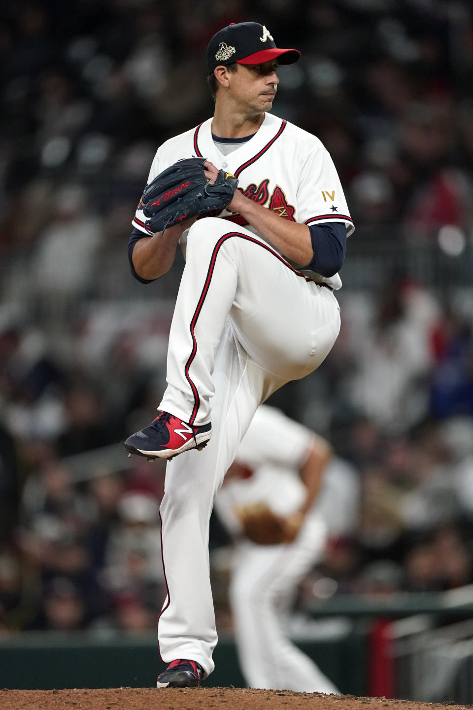 Atlanta Braves starting pitcher Charlie Morton (50) works against the Cincinnati Reds in the fourth inning of a baseball game Friday, April 8, 2022, in Atlanta. (AP Photo/John Bazemore)