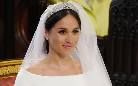 The Duchess of Sussex's hair was styled into a bun that was 'messy in a controlled way' - Credit: Jonathan Brady /PA