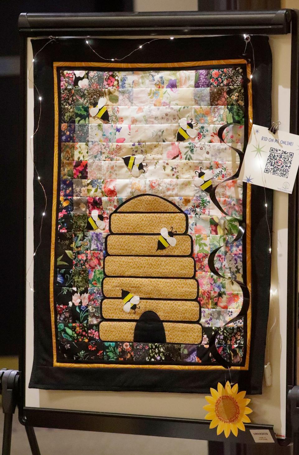 A bee quilt was one of the silent auction items at the first Family Resource Center Spelling Bee Fundraiser at Blue Harbor Resort, Thursday, April 18, 2024, in Sheboygan, Wis.