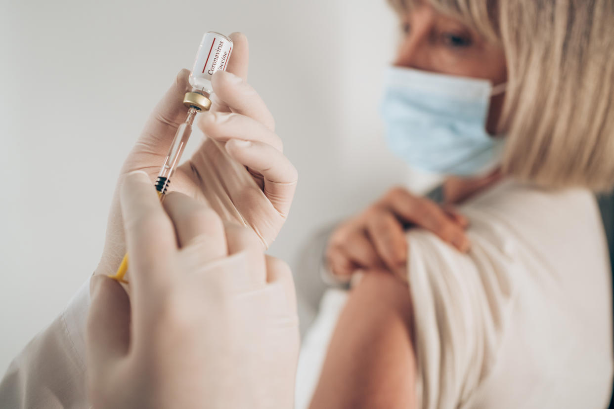 Woman receiving a COVID-19 shot. (Getty Images)