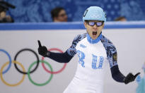 Victor An of Russia celebrates after his first place in the men's 500m short track speedskating final at the Iceberg Skating Palace during the 2014 Winter Olympics, Friday, Feb. 21, 2014, in Sochi, Russia. (AP Photo/Bernat Armangue)