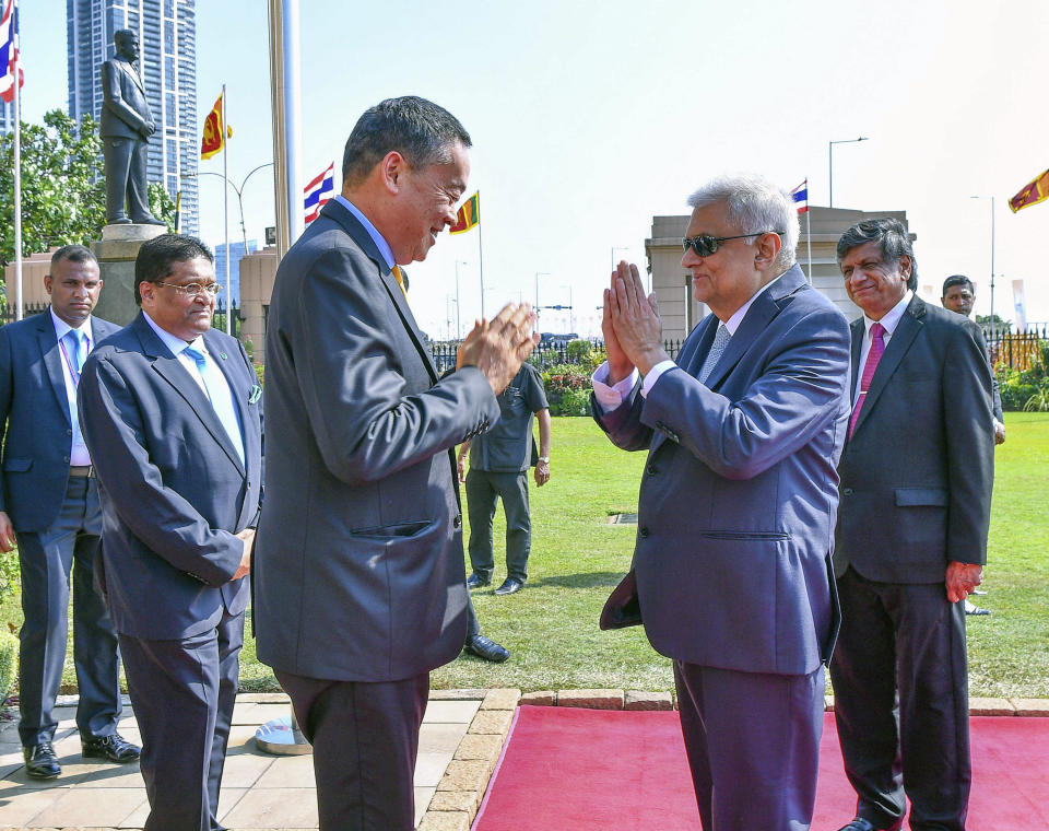 In this Handout photograph released by the Sri Lanka President's Office HO, Sri Lankan President Ranil Wickremesinghe, right, receives Thai Prime Minister Srettha Thavisin at the presidential secretariat in Colombo, Sri Lanka, Saturday, Feb. 3, 2024. (Sri Lanka President's Office HO via AP)