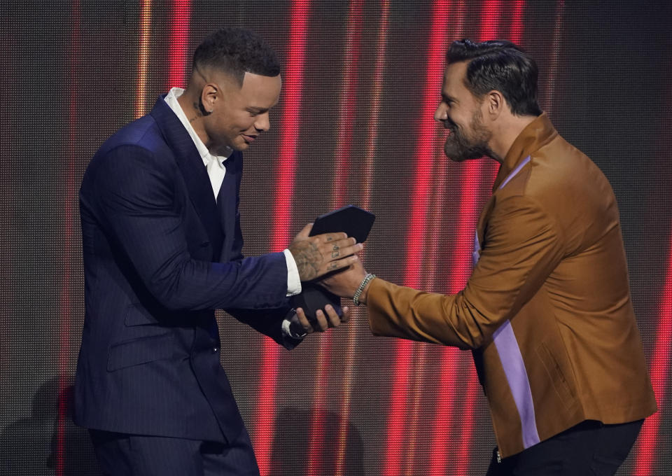 Jimi Westbrook of Little Big Town, right, presents Kane Brown with the award for male video of the year for "Worship You" at the CMT Music Awards at the Bridgestone Arena on Wednesday, June 9, 2021, in Nashville, Tenn. (AP Photo/Mark Humphrey)