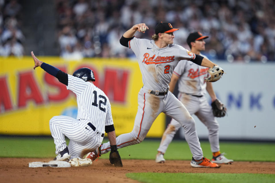 Baltimore Orioles third baseman Gunnar Henderson (2) throws to first base after forcing out New York Yankees' Isiah Kiner-Falefa (12) during the fifth inning of a baseball game Wednesday, July 5, 2023, in New York. Anthony Volpe reached first base on a throwing error by Henderson. A camera operator was struck on the head by Henderson's throw. (AP Photo/Frank Franklin II)