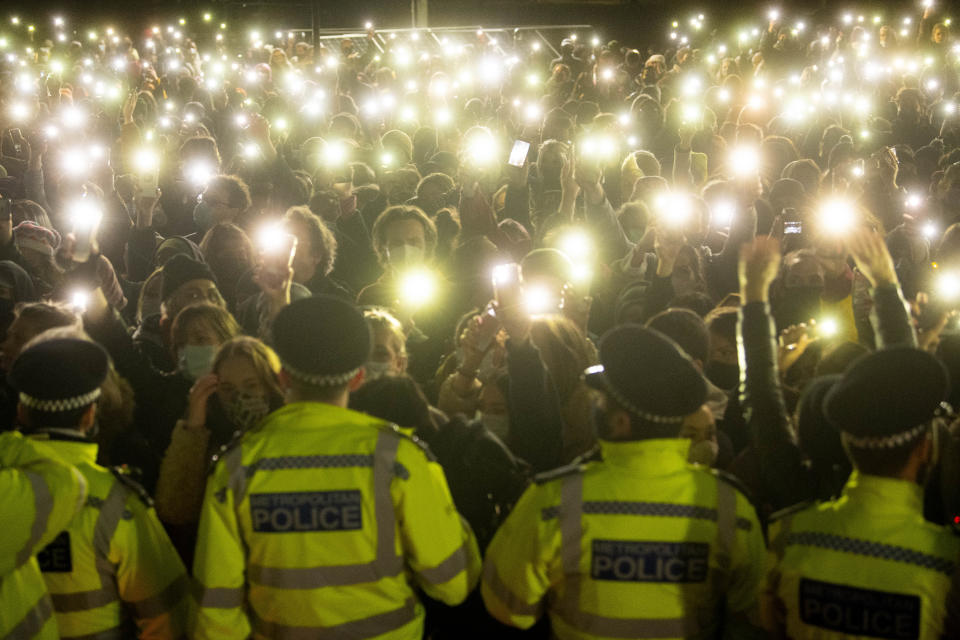 File photo dated 13/3/2021 of people in the crowd turn on their phone torches as they gather in Clapham Common, London, for a vigil for Sarah Everard. Police breached 