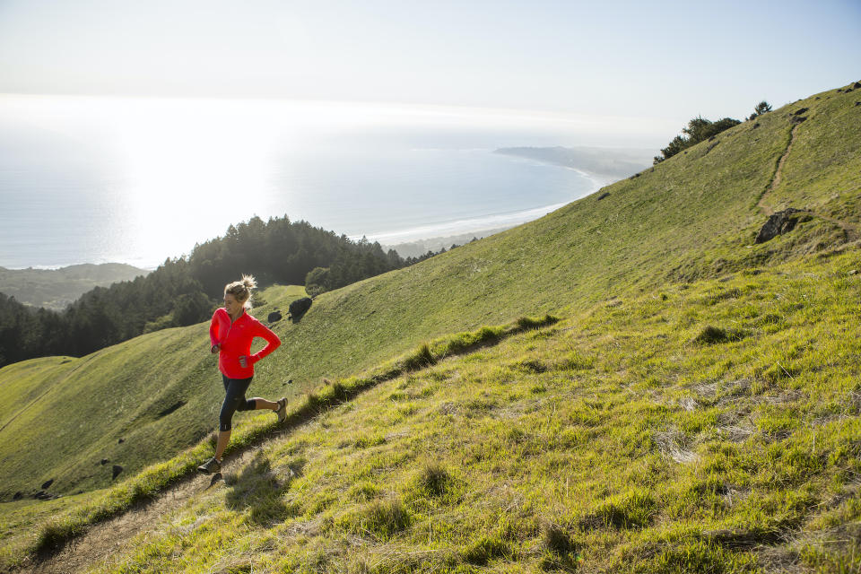 a woman running on a path