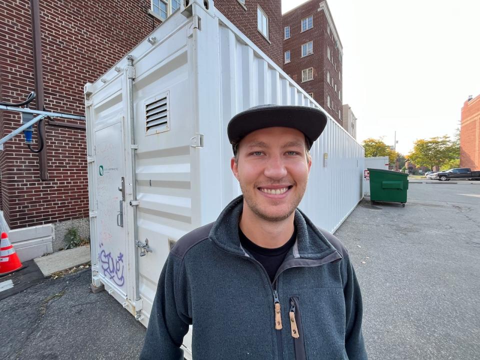 Inside this shipping container in downtown Ottawa, Dylan Mitchell, a farm operator with Heartee Foods, is growing and harvesting several varieties of gourmet mushrooms. (Hallie Cotnam/CBC - image credit)