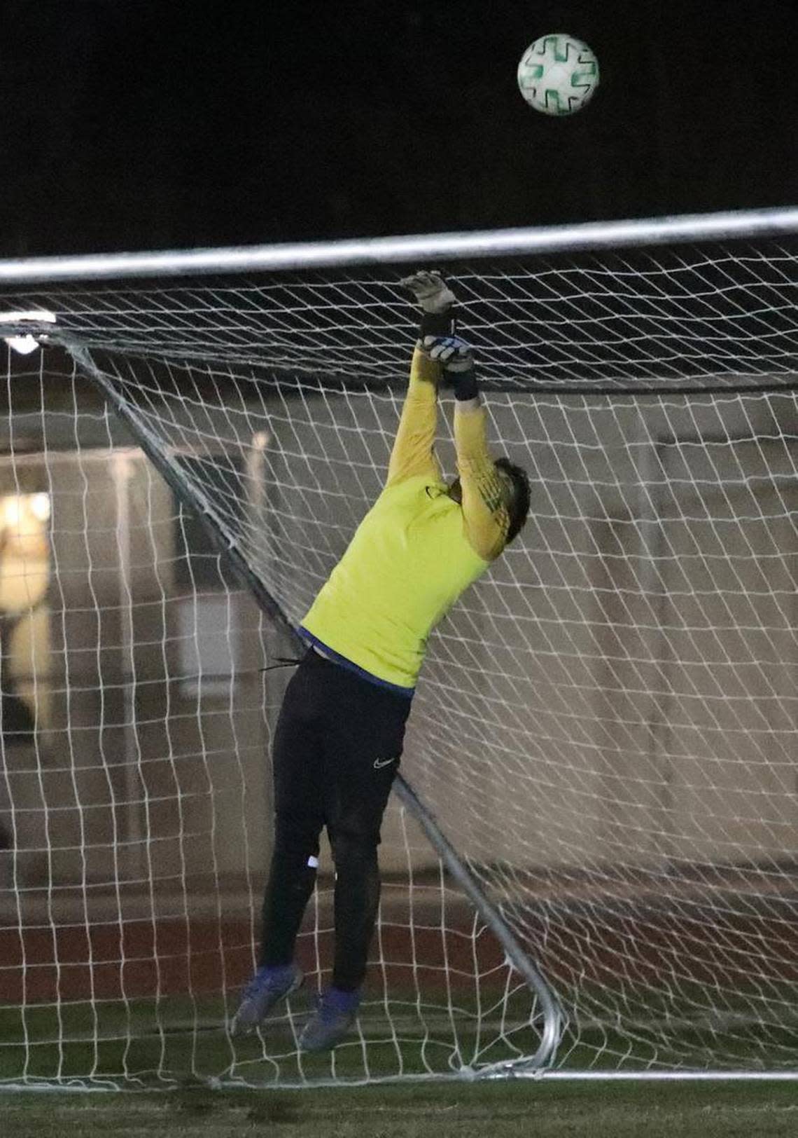 Sunnyside High senior goakeeper Daniel Cruz punches a shot over thee bar against host Roosevelt High during a CMAC/NYL match Jan. 25, 2023. Sunnyside improved to 19-1-3 (7-0) with a 5-1 win.