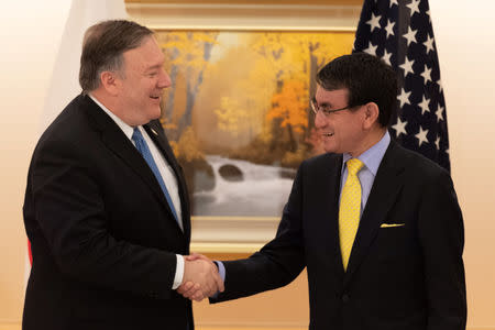 U.S. Secretary of State Mike Pompeo shakes hands with Japan's Foreign Minister Taro Kono before a meeting in Tokyo, Japan, October 6, 2018. Pierre-Emmanuel Delétrée/Pool via REUTERS