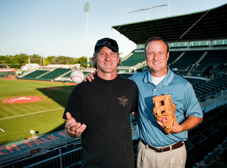 Kelly Gruber, left, and his younger brother David Gruber pose at UFCU Disch-Falk Field during the 2013 UIL state baseball tournament. Kelly led Westlake to the 1980 state championship before embarking on a 10-year MLB career. David Gruber followed with a state title in 1984. This year's team is in the Class 6A state tournament.