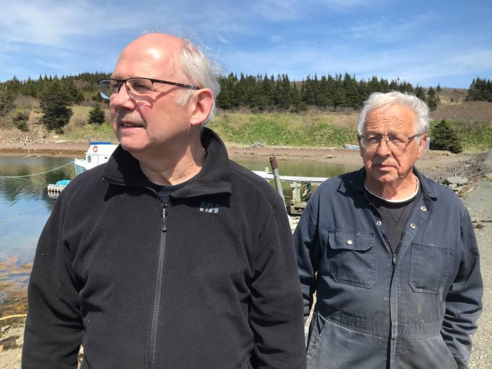 Keith Best, left, and Lew Baker are two of the four councillors in the Town of Come By Chance who had their seats vacated in early February for an alleged conflict of interest. A fifth councillor was dismissed last fall because of an alleged violation of residency rules. All five are appealing their dismissals to Newfoundland and Labrador Supreme Court. (Terry Roberts/CBC - image credit)