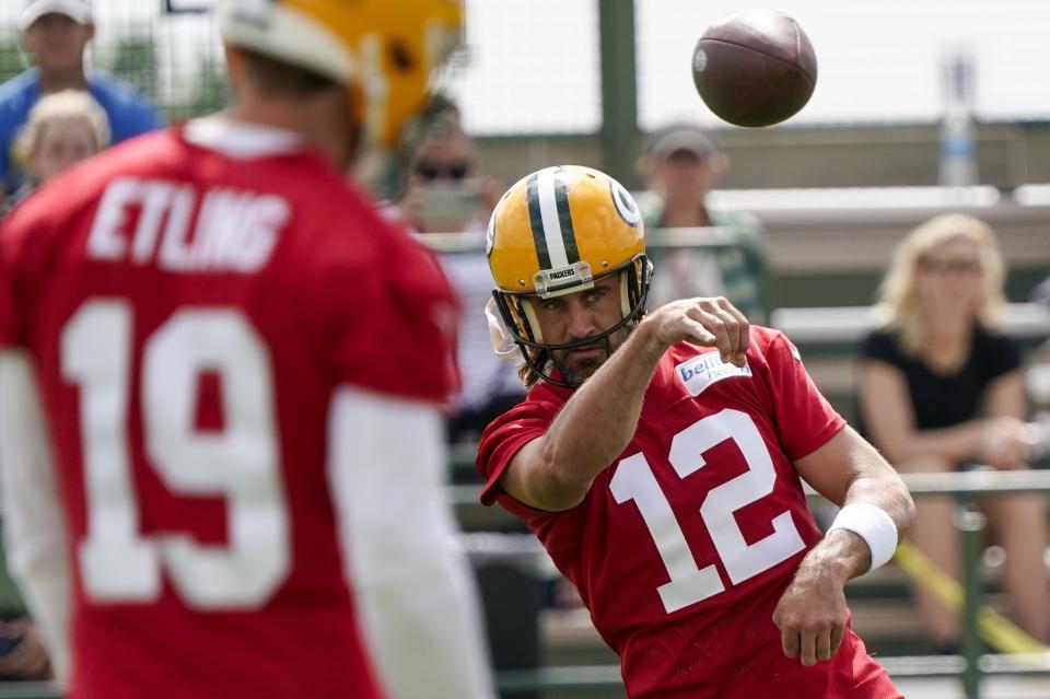 Green Bay Packers' Aaron Rodgers runs a drill at the NFL football team's practice field Wednesday, July 27, 2022, in Green Bay, Wis. (AP Photo/Morry Gash)